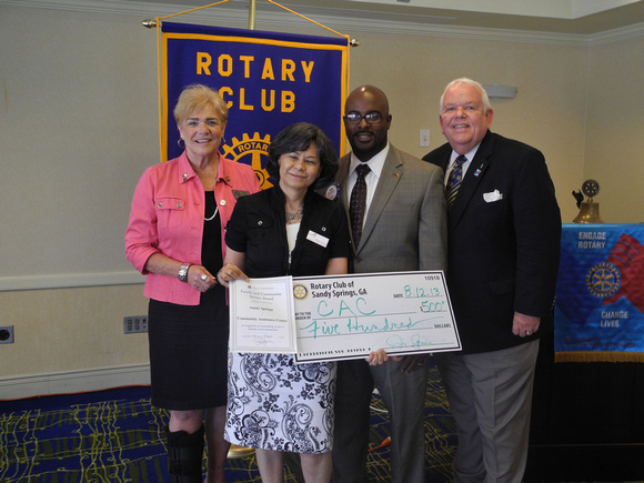 Pictured: l-r Rotary Club of Sandy Springs members Fran Farias, Tamara Carrera (Executive Director, CAC), Cory Jackson and Jim Squire