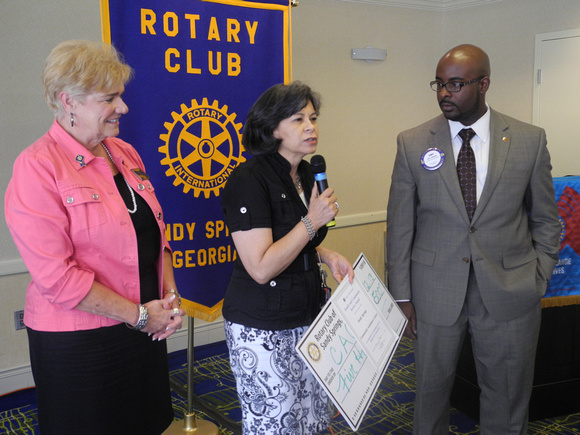 Pictured: l-r Rotary Club of Sandy Springs members Fran Farias, Tamara Carrera (Executive Director, CAC), Cory Jackson