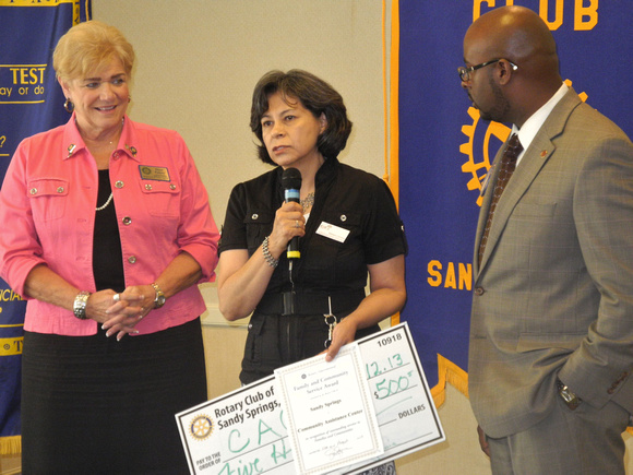 Pictured: l-r Rotary Club of Sandy Springs members Fran Farias, Tamara Carrera (Executive Director, CAC), Cory Jackson